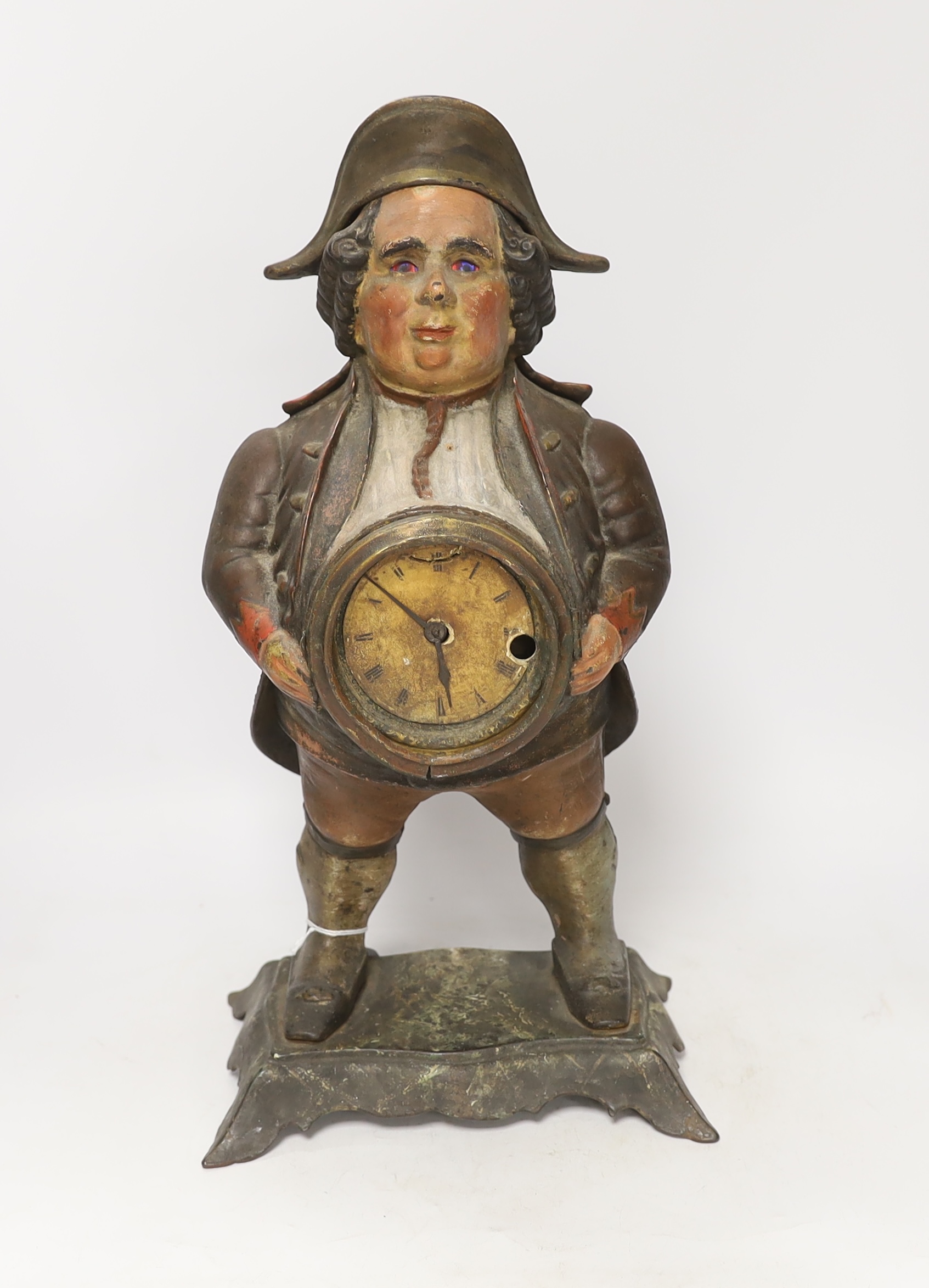 An early 20th century cast iron cold painted cased Bradley and Hubbard 'blinking eye' clock, in the form of a figure, 41cm